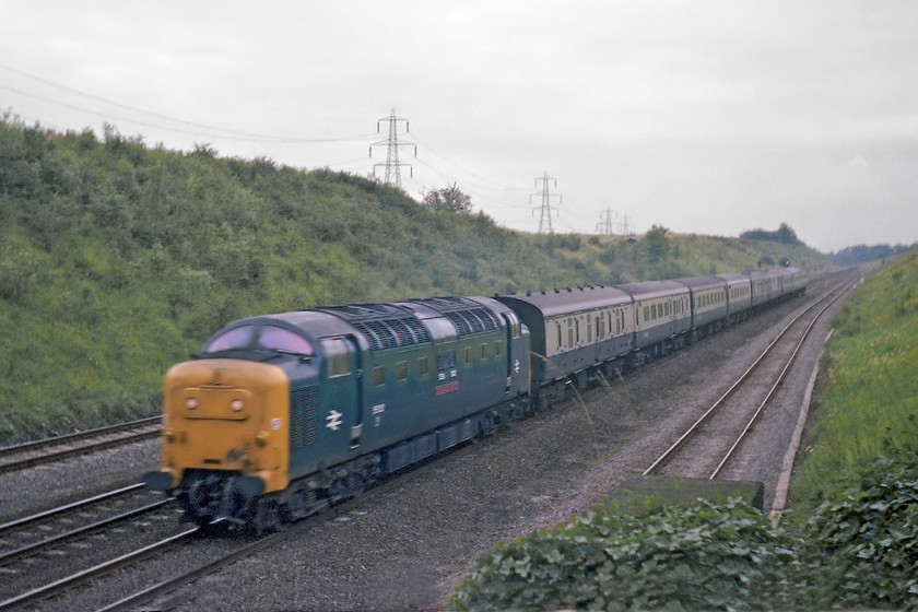 55013, 16.16 Newcastle-London Kings Cross (1A29), Westby SK962271 
 Standing on the ivy covered bridge supports deep down in Stoke cutting near to Westby sees 55013 'The Black Watch' lead the 16.16 Newcastle to King's Cross. Yes, the picture is a bit blurred but remember the technology that I was working with was my hand-me-down Exa camera that was already old when I acquired it. Its maximum 1/150 sec. shutter speed did create some issues with motion blur as can be seen here. 
 Keywords: 55013 16.16 Newcastle-London Kings Cross 1A29 Westby SK962271