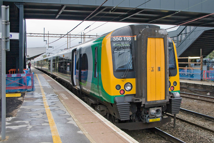 350118, LM 09.33 Birmingham New Street-London Euston (1W08), Northampton station 
 A little unusually, our train to London, the 09.33 Birmingham to Euston, departed from Northampton's platform two rather than the customary platform one. London Midland's 350118 and another unit on the rear wait to leave whisking my wife and off for our day out. 
 Keywords: 350118 09.33 Birmingham New Street-London Euston 1W08 Northampton station London Midland Railway Desiro