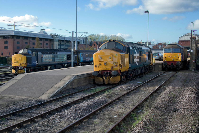 37419, 37409 & 57003, stabled, Norwich station 
 As the Wherry Lines were closed for extensive resignalling the DRS loco. hauled trains were not running. The stock and engines were stabled next to Norwich station as shown here with 37419, 37409 and 57003 
 Keywords: 37419 37409 57003 stabled, Norwich station