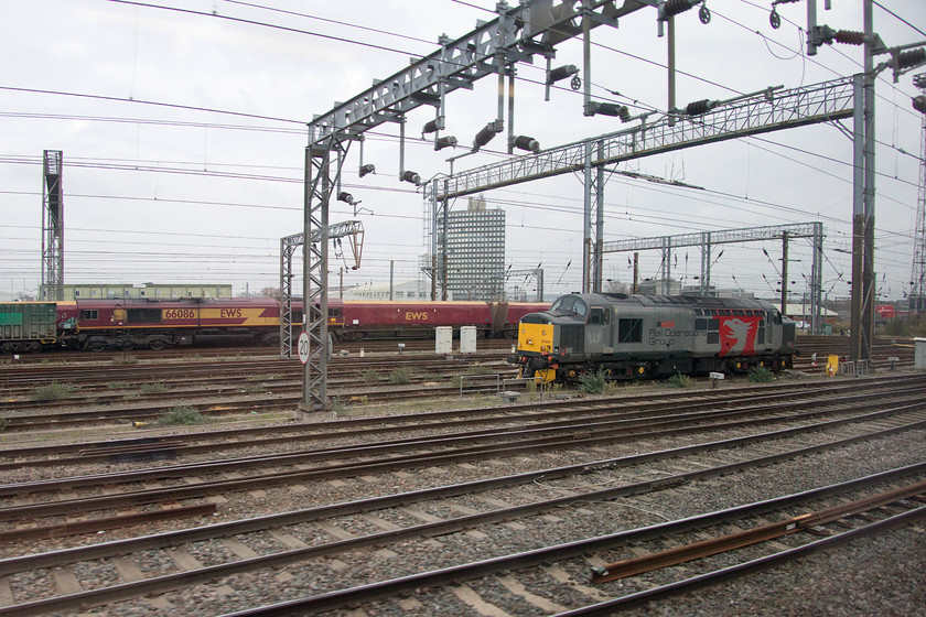 66086 & 37601, stabled, Wembley Yard 
 Passing the southern end of Wembley Yard finds 66086 stabled close to veteran English Electric 37601 'Perseus'. It has become fairly common place to find one of ROG's class 37s in the confines of Wembley Yard and usually in a conspicuous spit such as this. 
 Keywords: 66086 37601 stabled Wembley Yard