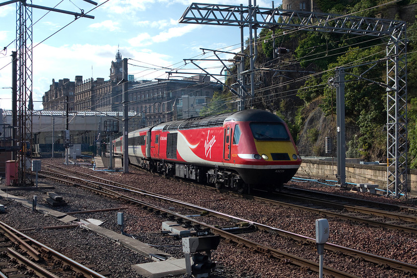 43239, GR 13.47 Aberdeen-London King`s Cross (1E23), Edinburgh Waverley station 
 43239 leads the 13.47 Aberdeen to London King's Cross HST service away from Edinburgh Waverley. I am standing at the far end of the long and remote platform seven. The skyline is dominated by the huge five star Balmoral Hotel that was originally built as the North British Station Hotel. 
 Keywords: 43239 13.47 Aberdeen-London King`s Cross 1E23 Edinburgh Waverley station