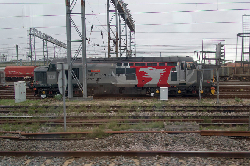 37601, stabled, Wembley Yard 
 In its impressive ROG livery veteran type 3, 37601'Perseus', sits stabled in Wembley Yard. It's testament to their enduring design that fifty years after their design and introduction that these locomotives are still in front line duty on the network. 
 Keywords: 37601 stabled Wembley Yard