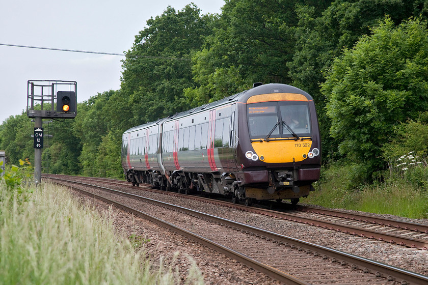 170522, XC 13.22 BNS-Standsted Airport (1L42, 13L), Egleton SK869070 
 A two-car 170522 works the 1L52 13.22 Birmingham new Street to Stansted Airport. To its left can be seen distant colour light OM12R. This signal is controlled by the 1899 Midland signal box in Oakham some one and half miles away. Acting just as a semaphore, it shows caution if the home is at danger. 
 Keywords: 170522 1L42 Egleton SK869070