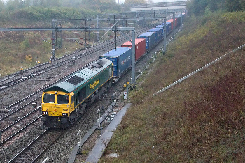 66693, 06.15 Trafford Park-London Gateway 4L97 Loughton Redway bridge, Milton Keynes 
 Emerging from the mist as it passes through Milton Keynes Freightliner's 66693 leads the 06.15 Trafford Park to London Gateway service. The 4L97 went on to arrive a little late at its destination despite being on time here in Milton Keynes. 
 Keywords: 66693 06.15 Trafford Park-London Gateway (4L97, 13L), Loughton Redway bridge, Milton Keynes Freightliner