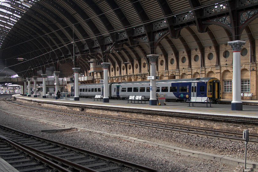 158842, NT stabled, York station 
 A relatively simple and ordinary photograph of 158842 stabled in the only remaining north-facing bay platform at York station. I was unable to identify the working for this Northern unit so I presume that it was stabled throughout the day. The photograph was taken specifically to compare with ..... https://www.ontheupfast.com/p/21936chg/25492182404/x55009-10-55-london-kings-cross-edinburgh taken some forty-three years earlier. I could not muster a Deltic nor a Class 101 in this 2021 image but the rest of what can be seen remains reassuringly similar. 
 Keywords: 158842 stabled York station Northern Trains