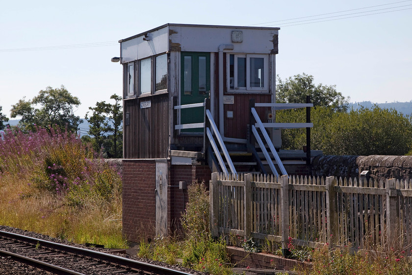 Onibury signal box (BR, 1977) 
 Having criticised Railtrack's attempt at building a new box in the 2000 at Craven Arms, BR's attempt is pretty awful too! It is a BR (WR) Type 37 box that was constructed in 1977. Despite some searching, I have been unable to find a reason why this was constructed and if it replaced another signal box, can anybody shed any light? As an aside, my notes from my 1981 visit state that at Onibury there was a 'new signal box'; it would have been just four years old then! 
 Keywords: Onibury signal box