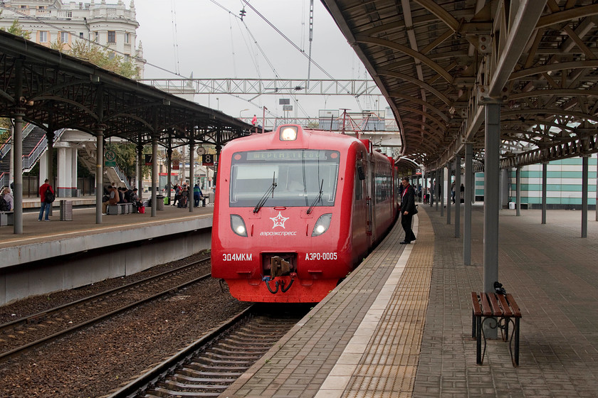 ED4MKM-AERO-0005, 10.00 Moscow Belorussky-Sheremetevo airport (10.00 Moscow Belorussky-Sheremetevo airport), Moscow Belorussky station 
 As well as being one of Moscow's terminus stations, Belorussky station also has a number of busy through platforms. This one, platform two serves Sheremetevo airport via a thirty-minute shuttle service that leaves on the hour and half hour. The trains are a little slow, despite having no scheduled intermediate stops, and thus can't really live up to their Aeroexpress name. The services are worked exclusively by the ED4MKM-AERO subset of which there are seven. This family of EMU, that is found all over the RZD network, are built by DMZ at their factory close to Moscow. We travelled on ED4MKM-AERO-0005 to Sheremetevo airport finding the train comfortable and well designed for luggage storage. It was also excellent value for money costing just 13 for the three of us. 
 Keywords: ED4MKM-AERO-0005 10.00 Moscow Belorussky-Sheremetevo airport Moscow Belorussky station