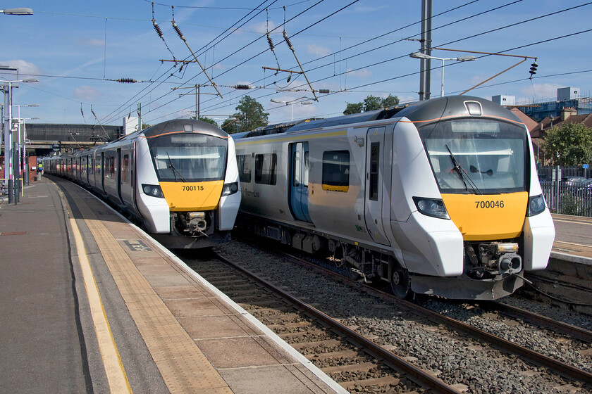 700115, TL 10.19 Bedford-Brighton (9T25, 14L) & 700046, TL 10.14 Bedford-Bedford CS (5R15, RT), Bedford station 
 Bedford has become the go-to location for enthusiasts to collect the numbers of the Class 700s. Not on;y are many seen operating services southwards to and through London but there is a large depot and many sidings where they are maintained and stabled. In this photograph 700046 is heading the short distance into the sidings as the 10.14 5R15 from the station where it has just arrived from London. To the left 700115 will soon work the 10.19 Thameslink service to Brighton. 
 Keywords: 700115 10.19 Bedford-Brighton 9T25 700046 10.14 Bedford-Bedford CS 5R15 Bedford station Thameslink