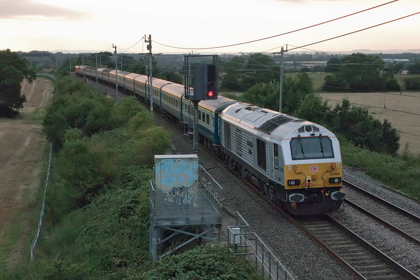 67029, 19.16 Wembley Central-Liverpool South Parkway footex (1Z91), Milton Crossing 
 67029 'Royal Diamond' brings up the rear of the 19.16 Wembley Central to Liverpool South Parkway footex carrying disappointed Liverpool supporters home after their team lost the Community Sheild to Manchester City 5-4 on penalties. The electric at the front, 90019 'Intermodal' lead the outward and return working so both locomotives will have run round when the train was laid-up in Wembley yard. It would have made sense to have an electric at both ends to avoid this rather unnecessary move but I suspect that on arrival at Liverpool South Parkway that the electric would have been detached and 67029 would have taken the train back to its base at Burton-on-Trent where there are no wires. 
 Keywords: 67029 19.16 Wembley Central-Liverpool South Parkway footex 1Z91 Milton Crossing