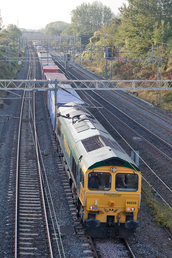 66526, 04.25 Felixstowe North-Lawley Street (4M88), Victoria bridge 
 With the driver casually resting his head on his hand in the cab of 66526 'Driver Steve Dunn (George)' as it passes Victoria bridge between Roade and Ashton. The locomotive, named after the driver of the freight train involved in the Selby crash in 2001, was leading the 04.25 Felixstowe to Garston Freightliner. 
 Keywords: 66526 04.25 Felixstowe North-Lawley Street 4M88 Victoria bridge