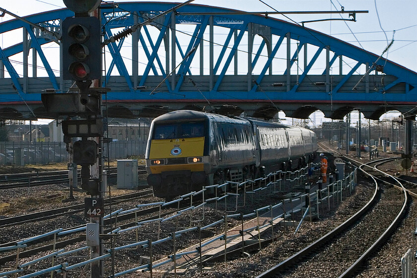 91110, EC 09.35 London King's Cross-Leeds, Peterborough station 
 With the 1913 built Crescent Bridge to the south of Peterborough station dominating the scene 91110 'Battle of Britain Memorial Flight' passes at line speed working the 09.35 King's Cross to Leeds service. Notice the track worker safely in the designated walking route created as part of the station redevelopment programme. 
 Keywords: 91110 09.35 London King's Cross-Leeds Peterborough station IC225 BATTLE OF BRITAIN MEMORIAL FLIGHT