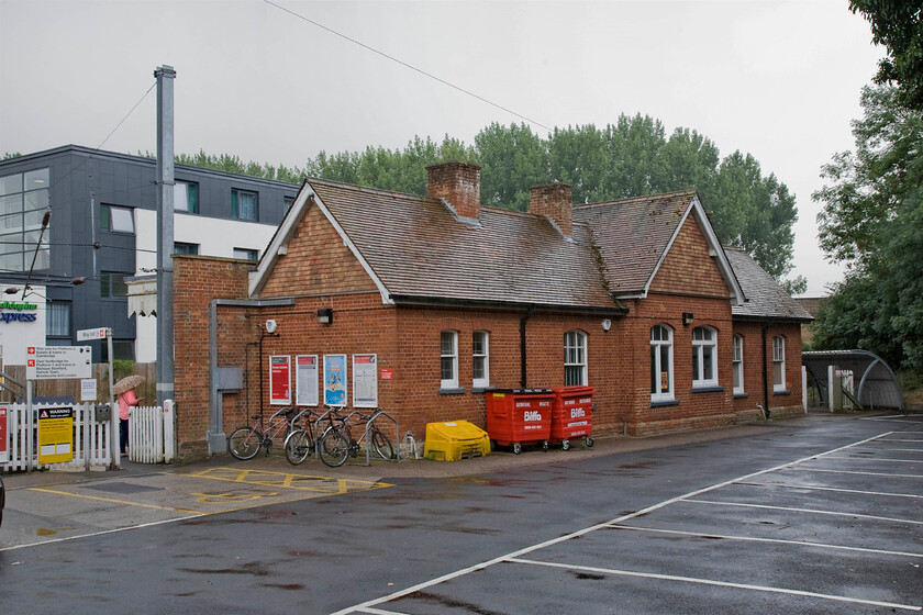 Frontage, Whittlesford Parkway station 
 Located just under fifty miles from London (Liverpool Street) Whittlesford station is a delightfully proportioned building that opened in this form in 1890. In this photograph, it contrasts with the ugly modernist design of the Holiday Inn Express building on the other side of the station. 
 Keywords: Frontage Whittlesford Parkway station