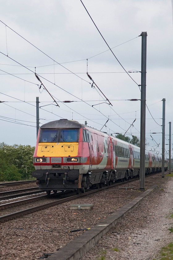 82213 & 91130, GR 10.05 Leeds-London Kings Cross (1A22, 2L), White House Crossing TL227777 
 DVT 82213 leads the 10.05 Leeds to London King's Cross with 91130 'Lord Mayor of Newcastle' pushing at the rear. The train is seen heading south past White House Crossing near the village of Abbots Ripton in Huntingdonshire. Unfortunately, I did not get the placing of the train quite where I wanted it as the electrification mast is just behind the cab of the DVT to the left! I tend not to use the power burst function on the camera seeking to use my eye and reactions to get the train in the right place; this also keeps the camera's shutter count down! 
 Keywords: 82213 91130 1A22 White House Crossing TL227777