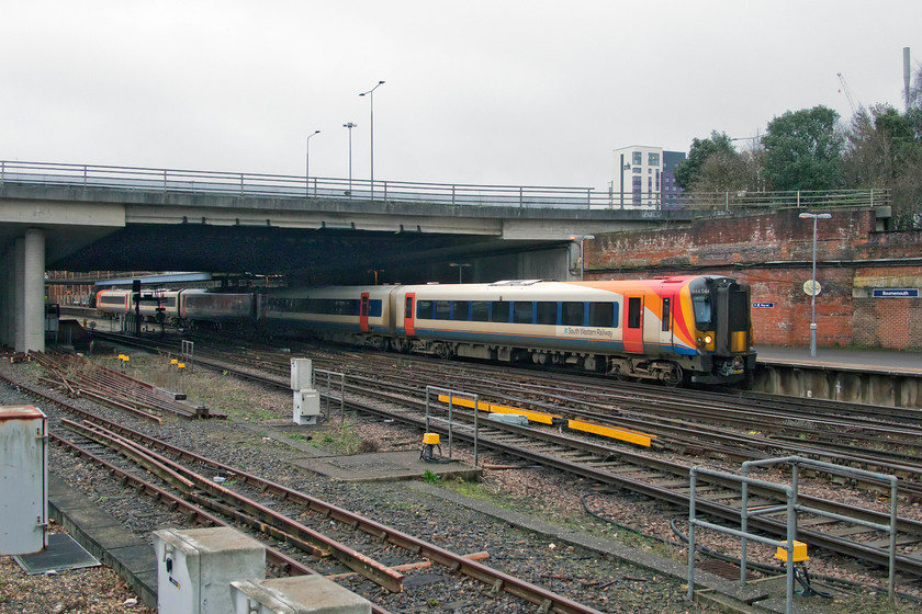 444044, SW 12.33 London Waterloo-Weymouth (3W25, 1L), Bournemouth station 
 444044 leaves Bournemouth station forming the 12.33 Waterloo to Weymouth service. I am standing in the expansive station car park that now occupies the site of the former steam shed (70F) that closed in the summer of 1967. 
 Keywords: 444044 12.33 London Waterloo-Weymouth 3W25 Bournemouth station SWR South Western Railway