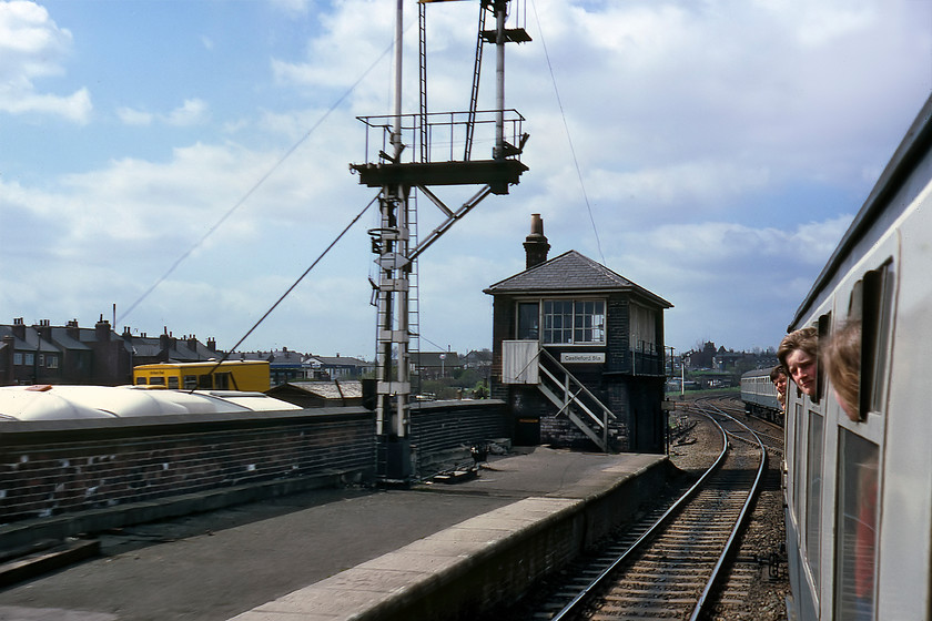 Castleford Station Signal Box (NE, c.1882) 
 With others looking on, we pass through Castleford station viewed in an almost due westerly direction. On the platform end is the compact Station signal box. It is an NER box dating from circa 1882. As well as controlling the semaphore, it also controlled the line to Ferrybridge via Pontefract that can be seen curving off to the left in this image behind the box. The box remained in use until 1987 when it was replaced by a portacabin box a short distance away at the town's busy level crossing. Today the box still stands but is boarded up and looks somewhat forlorn, see..... https://www.ontheupfast.com/p/21936chg/23791610604/castleford-station-signal-box-ne 
 Keywords: Castleford Station Signal Box NER North Eastern Railway