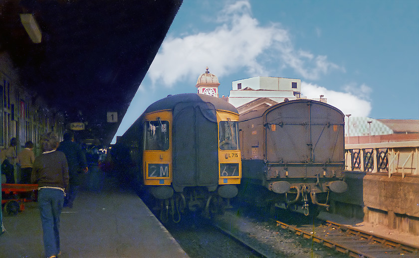 Class 123 DMU set L713, unidentified Cardiff Central-Crewe working (2M67), Cardiff Central station 
 A four-car class 123 DMU set number L713 (W52105, W59821, W59237 & W52093) sits at Platform 1 of Cardiff Central. It is five months since headcodes were abandoned but this train is still wearing 2M67. If it was a driver who still wanted to maintain old traditions, then this DMU was working a Cardiff to Crewe working. If not, then I have no idea as to its destination? It's a busy scene at Cardiff with lots of people, a lot of whom were spotters I suspect. Notice the buffet sign illuminated selling its Traveller's Fare products of dubious quality! 
 Keywords: Class 123 DMU L713 2M67 Cardiff Central station