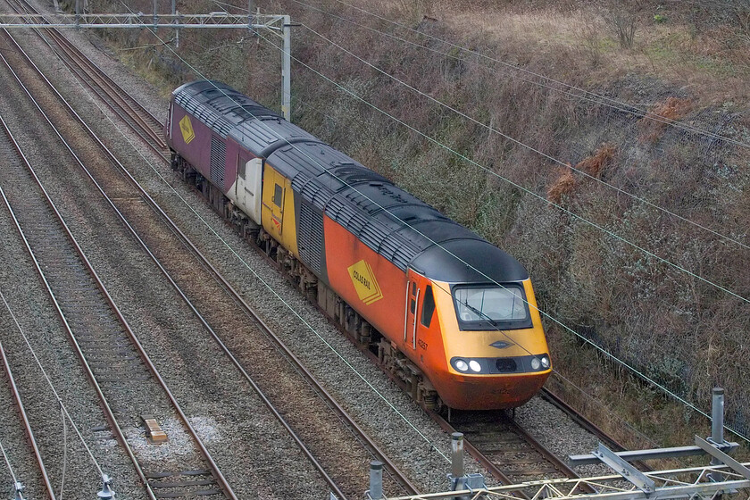 43247 & 43264, 09.55 Rugby Depot Access-Rugby Depot Access (0Z44, 5E), Hyde Road bridge 
 I had been ready to go out and see the 09.55 Rugby Depot Access return working (via two return trips from Milton Keynes to Oxford) from its due departure time. By 10.30 nothing appeared on OTT so I began to think that it would be capped. Finally, it appeared and I got ready to go out only to find that it disappeared again. Fearing a problem I consigned myself that it was to be cancelled. However, nearly an hour and a half late it appeared again and got underway straightaway. I nipped out on Bertie the Brompton and captured HST power cars 43247 and 43264 passing Roade. It was undertaking some sort of test runs on the still-yet-to-be-opened east-west rail link. Andy and I are due to traverse the route in just under two weeks on a charter so I hope that all the tests have been passed successfully! 
 Keywords: 43247 43264 09.55 Rugby Depot Access-Rugby Depot Access 0Z44 Hyde Road bridge Colas