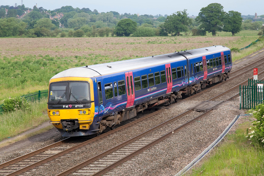 165130, GW 07.53 Oxford-Banbury (2L38), Warkworth SP476394 
 This is probably about as far north as First Great Western operate on the network. They operate a shuttle service between Oxford and Banbury stopping at all the intermediate stations. Here, 165130 is seen working the 07.53 Oxford to Banbury that will arrive at its destination, seen in the background, in a few minutes. 
 Keywords: 165130 07.53 Oxford-Banbury 2L38 Warkworth SP476394