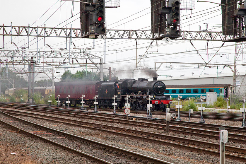 45690, 14.44 Crewe-Crewe Heritage Centre (via Gresty Bridge), Crewe station 
 45690 'Galatea' drifts back through Crewe station with its support coach having completed a move that involved it turning to face north after heading down from Carnforth earlier in the day. It was making the short journey to the Crewe Heritage Centre. 
 Keywords: 45690 Crewe station