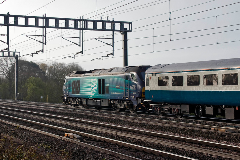 68003, outward leg of The Snowdonia Panorama, 07.09 London Euston-Llandudno (1Z23), Ashton Road bridge 
 Not a great picture of 68003 'Astute' on the rear of The Snowdonia Panorama charter as it passes between Roade and Ashton on the WCML down fast near Northampton. However, this was my first chance to photograph this particular class 68 as they are not that common a sight in this area. I particularly like this set of Mk. IIf stock that is often used for charters. It give s a very authentic and period feel to a day out often with a heritage diesel of the same era, but not today as a class 68 does not quite cut it! 
 Keywords: 68003 The Snowdonia Panorama 07.09 London Euston-Llandudno 1Z23 Ashton Road bridge