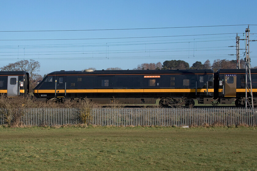 82201, 06.44 Eastleigh Arlington-Worksop Down Reception (5Q26), Wilson's Crossing 
 The second DVT in the 06.44 Eastleigh (Arlington Services) to Worksop Reception sidings is seen broadside with its associated stock behind it. 82201 was being towed, along with another former Grand Central set, by ROG's 47812. With the plans to introduce this refurbished and repainted stock on Blackpool to Euston services now abandoned one wonders what the future holds for them. I have photographed 82201 many times, for example..... https://www.ontheupfast.com/p/21936chg/24946503204/x82201-1a13-biggleswade-tl192433 but could this be the last time? 
 Keywords: 82201 06.44 Eastleigh Arlington-Worksop Down Reception 5Q26 Wilson's Crossing GC Grand Central