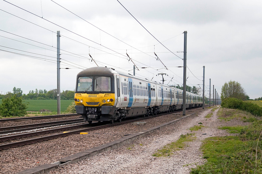 365533, GN 11.46 Peterborugh-London Kings Cross (1P61, RT), White House Crossing TL227777 
 365533 passes the soon to be closed White House footpath crossing just north of Huntingdon on the ECML with the 11.46 Peterborough to King's Cross 1P61 working. As can be seen here, the weather was very grey with very flat lighting that made quality photography tricky! 
 Keywords: 365533 1P61 White House Crossing TL227777