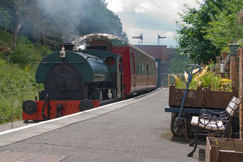 2104, 11.15 ex Pitsford-Father`s Day special, Pitsford & Brampton station 
 Peckett & Sons 0-4-0 2104 brings the 11.15 Father's Day Pitsford return working through Pitsford and Brampton station. In this view, the diminutive size of the 1948 built locomotive is clearly seen when compared to the Mk. II coach it is leading. The Peckett was built with a nine feet ten inches loading gauge along with two others, 2103 and 2105 (both also preserved) for use at Croydon paower station 
 Keywords: 2104 11.15 ex Pitsford-Father`s Day special Pitsford & Brampton station