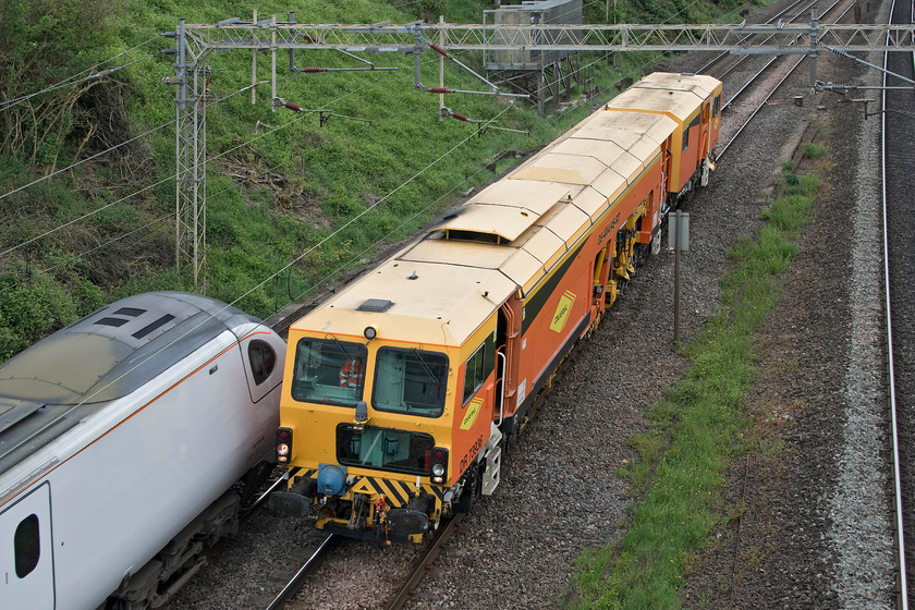 DR73936, 13.00 Watford London Concrete-Fenny Compton sidings (3E) & 390001, VT 12.45 Wolverhampton-London Euston (1B52, 2L), Victoria bridge 
 Colas operated Plasser & Theurer tamper number DR73936 heads north along the down slow line at Victoria bridge as the 13.00 Watford London Concrete to Fenny Compton move. The photograph is taken just as 390001 'Bee Together' passes with the 12.45 Wolverhampton to Euston Avanti West Coast service. 
 Keywords: DR73936 13.00 Watford London Concrete-Fenny Compton sidings 390001 12.45 Wolverhampton-London Euston 1B52 Victoria bridge Avanti West Coast Pendolino Bee Together