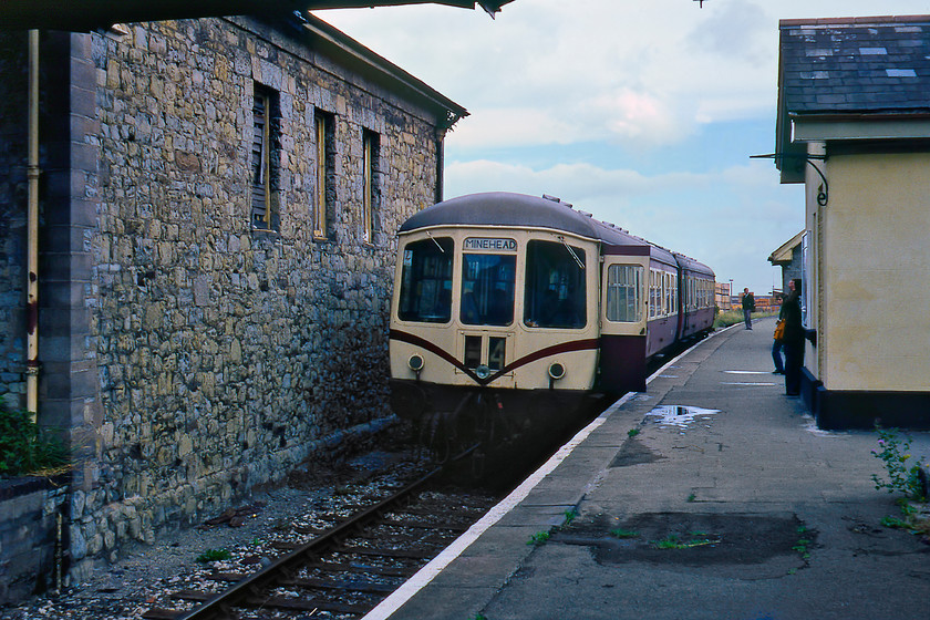 Class 103 DMU, W56169 & W50414, 11.55 Watchet-Minehead, Watchet station 
 A Park Royal Class 103 DMU made up of DTCL W56169 and DMBS W50414 pauses at Watchet station. I have just alighted from this train that had worked the 11.25 from Minehead and had terminated here at Watchet. Once the crew have changed ends it will then work the 11.55 return working. Of the two cars making up this DMU W50414 remains in operation on the West Somerset Railway whilst the other is currently undergoing a long restoration at the Helston Railway in Cornwall.

There is an audio recording of this event on my youtube channel, see..https://youtu.be/eCT7OtEH7mc 
 Keywords: Class 103 DMU W56169 W50414 11.55 Watchet-Minehead Watchet station