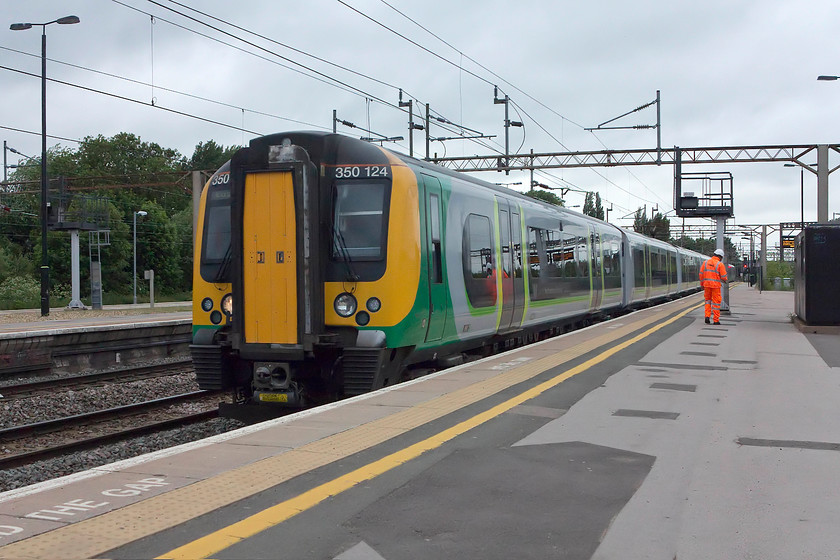 350124, LN 08.33 Birmingham New Street-London Euston (1W06, 10L), Northampton station 
 On a grey June day, London Northwestern 350124 arrives into Northampton forming the 08.33 Birmingham new Street to London Euston. This is a 'fast' 3-stop train to London that is one that we regularly catch, as on this day. 
 Keywords: 350124 1W06 Northampton station