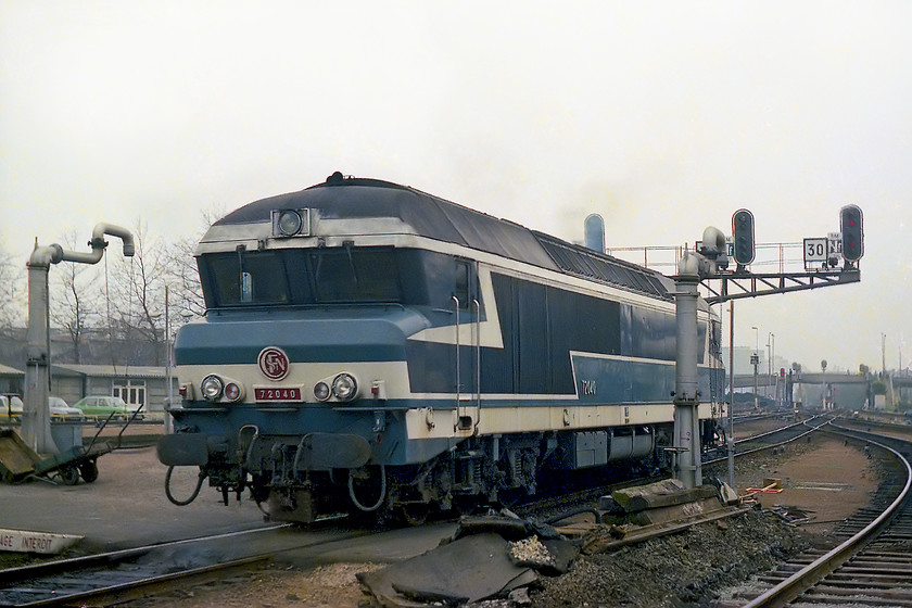 72040, running round, Nantes station 
 SNCF class CC 72040 runs round a train at Nantes station. I remember being impressed by the size and noise of these relatively new diesels as an impressionable 14-year-old spotter! Notice in this image the two platform-end water columns. Steam had only finally been banished from SNCF rails four years prior to this image in 1974, a lot later than in the UK. 
 Keywords: 72040 running round Nantes station