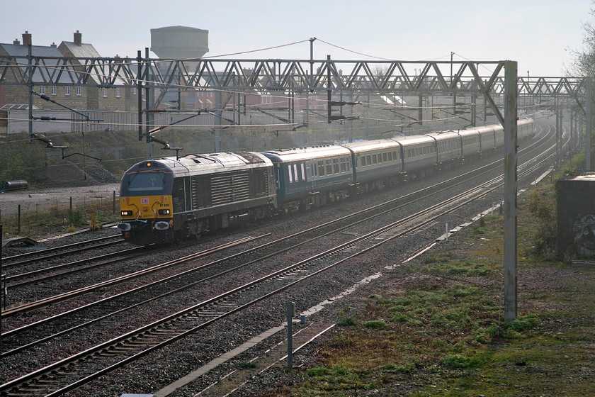 67006, outward leg of The Severn Valley Autumn Special, 08.07 London Euston-Kidderminster SVR (1Z67), site of Roade station 
 This is one of those occasions that I didn't really want the sun to put in an appearance! Looking south-east from the footbridge that spans the WCML at Roade in Northamptonshire meant early morning sun was going to be problematic. 67007 'Royal Sovereign' leads the classic set of BR liveried Mk. II stock as the 08.07 Euston to Kidderminster Severn Valley Railway. The excursion, named The Severn Valley Autumn Special, was carrying enthusiast for a day out on the railway's steam gala marking the end of the season (with the exception of the Santa Specials). 
 Keywords: 67006 The Severn Valley Autumn Special 08.07 London Euston-Kidderminster SVR 1Z67 site of Roade station special excursion Severn Valley Railway