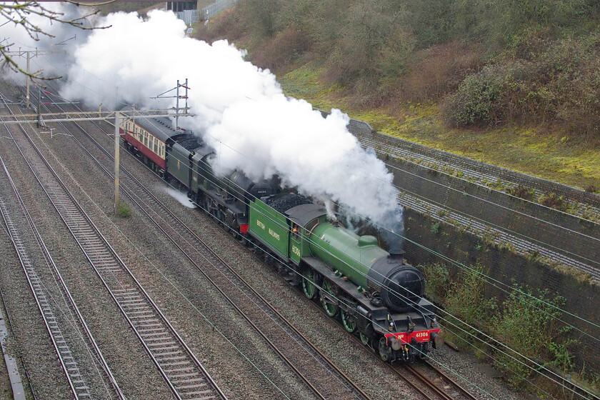 61306 & 46100, 08.55 Crewe HS-Southall LSL (5Z61, 11E), Roade cutting 
 At last a little bit of a respite from the rain in Roade cutting! Making a logistics move as 5Z61, the 08.55 Crewe HS to Southall LSL, is formed by 61307 'Mayflower' and 46100 'Royal Scott' and a support coach. Mayflower is working surprisingly hard given that 46100 was also in steam but I suspect not bringing much to the party! 
 Keywords: 61306 46100 08.55 Crewe HS-Southall LSL 5Z61 Roade cutting Mayflower Royal Scott