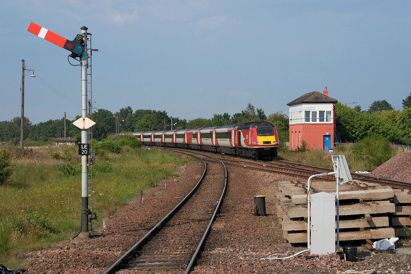 43305, GR 14.52 Aberdeen-London King s Cross (1E25, 116L), Leuchars station 
 LNER HST 43305 arrives at Leuchars station in beautiful afternoon light. The train is about to pass the former North signal box that controls the semaphores in the station area. Close examination reveals the signalman leaning out of the box watching the train pass, a practice to disappear from the network over the coming few years as this traditional aspect of the railway is finally phased out. This service was already late here at Leuchars, but by the time it reached its destination, it was just two minutes of being two hours late! 
 Keywords: 43305 14.52 Aberdeen-London King's Cross 1E25 Leuchars station