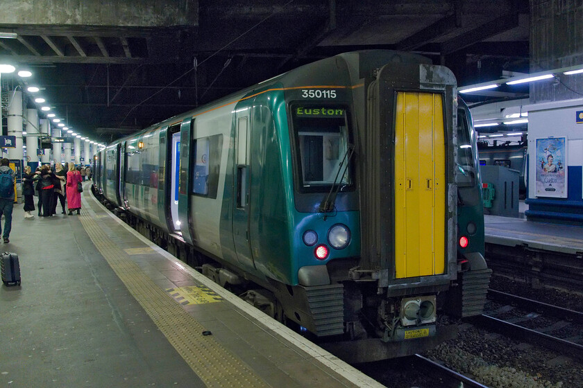 350115, LN 09.06 Birmingham New Street-London Euston (1Y26, 1L), London Euston station 
 Having arrived at Euston, I walked to the rear of our train (we were sitting at the back of the rear coach anyway) and photographed it. We travelled on board a very busy, for an 'off-peak' service, 350115 and another 350/2 subclass from Northampton as the 09.06 from Birmingham New Sreet 
 Keywords: 350115 09.06 Birmingham New Street-London Euston 1Y26 London Euston station London Northwestern Desiro