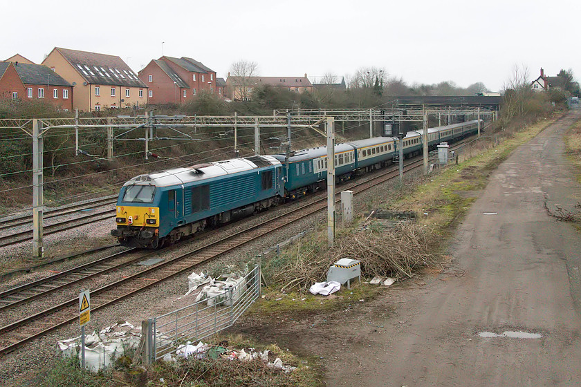 67002, outward leg of The Robert Burns, UKR 08.10 London Euston-York (1Z72, RT), site of Roade station 
 67002 is seen dead in tow on the rear of 'The Robert Burns' railtour from Euston to York passing the site of Roade station. The UK Railtour's charter was one of the first of the year and the first one that I have been out to and photographed. On this incredibly dull January morning, 67002's livery, that appears to be something akin to BR or monastral blue, matches the Mk.II coaching stock of the train. 
 Keywords: 67002, outward leg of The Robert Burns (1Z72, RT), site of Roade station UKR UK Railtours 08.10 London Euston-York