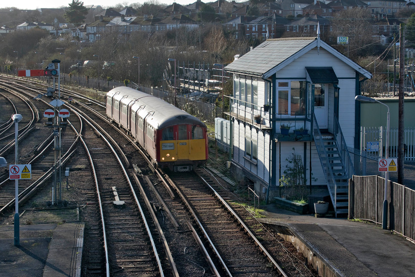 483006, SW 13.18 Shanklin-Ryde Pier Head (2U34) Ryde St. John`s Road station 
 For our final trip on The Island Line operated by South Western Railway, we took 483006 to Ryde Pier Head for the connecting SeaCat sailing back to Portsmouth Harbour. At Ryde St. John's Road station the 13.18 from Shanklin arrives past the delightful Southern Railway 1928 signal box that is still in use controlling the signalling on the whole line. 
 Keywords: 483006 13.18 Shanklin-Ryde Pier Head 2U34 Ryde St. John`s Road station Island Line SWT 1938 London Underground stock