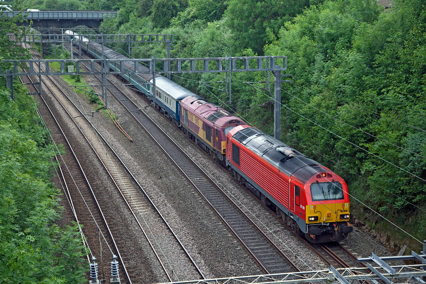 67010 & 67030, 08.30 London Paddington-Burton Ot Wetmore ECS (5Z51), Hyde Road Bridge 
 An hour after one ECS stock move another passes! This time, 67010 and 67 030 haul the 08.30 Paddington to Burton Ot Wetmore 5Z51. The train is about to enter Roade Cutting taken from a bridge above the line in the village of Roade. The stock is composed of a variety of Mk.II coaches in various liveries. 
 Keywords: 67010 67030 08.30 London Paddington-Burton Ot Wetmore ECS 5Z51 Hyde Road Bridge