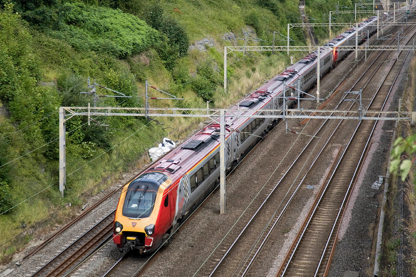 Class 221s, VT 08.18 Shrewsbury-London Euston (1B11), Roade cutting 
 A pair of Virgin Voyagers work the 08.18 Shrewsbury to London Euston 1B11 through Roade cutting. The Voyagers have completely taken over the WCML services that go away from the wires to places such as Shrewsbury and beyond to North Wales. 
 Keywords: Class 221 VT 08.18 Shrewsbury-London Euston 1B11 Roade cutting Virgin Trains Voyager