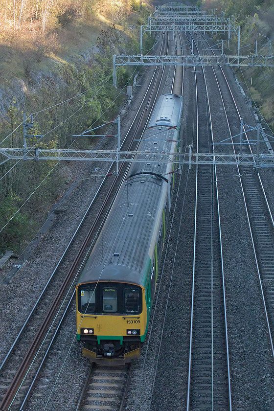 150109 & 153375, 14.45 Bletchley CS-Tyseley (5Y30), Roade Cutting 
 A regular Sunday working that I have managed very few picture of is the Bletchley to Tyseley ECS move. This involves the DMUs that have been used on the Bedford to Bletchley line returning to their Birmingham base for servicing and an exam. Another pair of units do the reverse journey to take up their duties on the Marston Vale line the following week. It is a move that will not last much longer as there are plans that the Vivarail class 230s will take over this service in the New Year. At the time of writing, testing is taking place on the line. 
 Keywords: 150109 & 153375, 14.45 Bletchley CS-Tyseley (5Y30), Roade Cutting