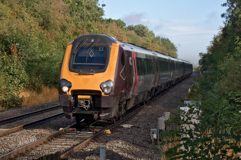 220023 & 220029, XC 06.39 Nottingham-Reading (1O06, RT), Tackley station 
 Just catching the early morning sunshine the 06.39 Nottingham to Reading CrossCountry service passes Tackley in Oxfordshire. The 1O06 train is being worked by Voyagers 220023 and 220029, something that they have been doing now for twenty years! The leading unit still wears the darker outline of the Virgin badge that was worn from their introduction until XC took over their operation from November 2007. 
 Keywords: 220023 220029 06.39 Nottingham-Reading 1O06 Tackley station CrossCountry Voyager