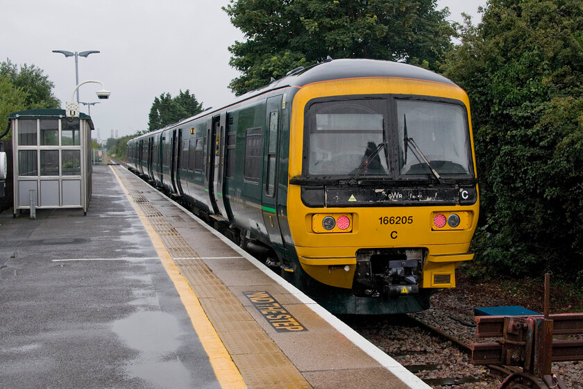 168005, GW 12.01 Severn Beach-Bristol Temple Meads (2K25, 1E), Severn Beach station 
 Having arrived at Severn Beach just over half an hour earlier on board 168205 it is seen again waiting to leave with the 2K25 12.01 return service to Bristol Temple Meads that we would also travel on. In the intervening thirty minutes or so we found a great little caf a short walk from the station where we took shelter from the relentless rain and wind; it was much appreciated. 
 Keywords: 168005 12.01 Severn Beach-Bristol Temple Meads 2K25 Severn Beach station GWR Turbo