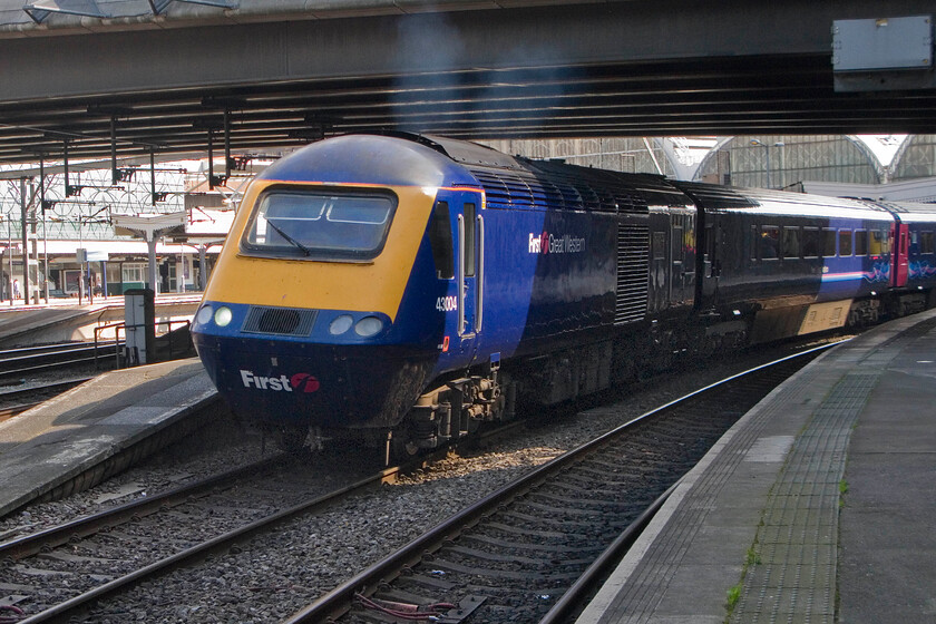 43004, GW 13.00 London Paddington-Bristol Temple Meads, London Paddington station 
 Clearly illustrating the twin exhaust set up from its MTU V16 4000 engine, 43004 'First for the future/First ar gyfer y dyfodol' leads the 13.00 FGW service to Bristol Temple Meads away from Paddington station. 
 Keywords: 43004 13.00 London Paddington-Bristol Temple Meads London Paddington station FGW First Great Western HST First for the future / First ar gyfer y dyfodol