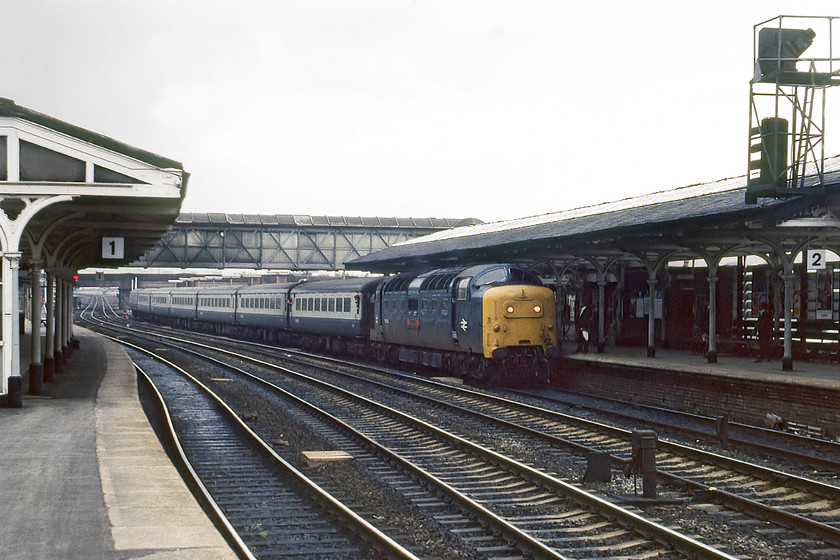 55006, 14.05 London King`s Cross-York (1L43), Selby station 
 55006 'The Fife and Forfar Yeomanry' arrives at Selby station leading the 1L43 14.05 King's Cross to York stopper service. These expresses were as well suited to Deltic operation as were the long distance high-speed services that they were better known for. Deltics rapid acceleration and their ability to maintain high running speed for short bursts and then to slow again for the next stop meant that these York services had tight timings. This photograph shows clearly the snaking track at the southern end of Selby station, one factor that contributed to it being a bottleneck that severely hampered timings on the ECML and one that partly precipitated the opening of the thirteen-mile diversion four years after this scene. 
 Keywords: 55006 14.05 London King`s Cross-York 1L43 Selby station