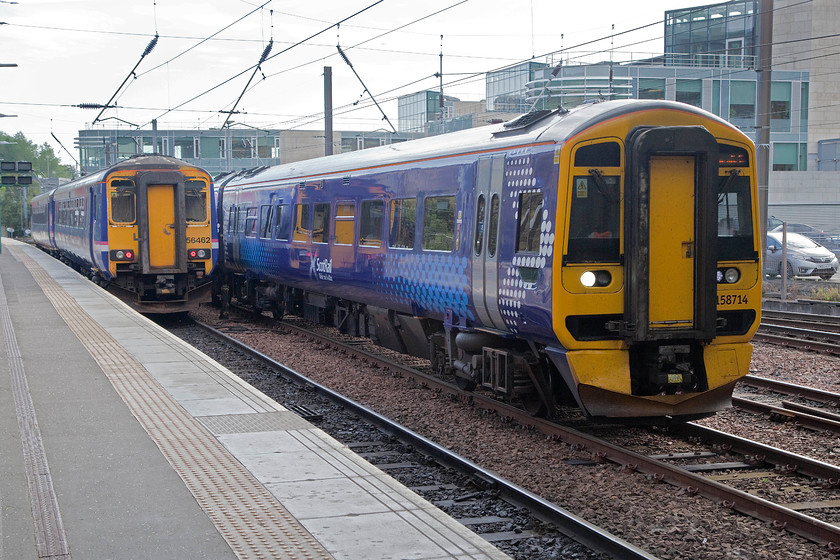 156462, SR 10.19 Edinburgh Waverley-Glasgow Central (1D53) & 158714, SR 09.01 Tweedbank-Edinburgh Waverley (2T65), Edinburgh Waverley station 
 At the eastern end of Waverley station, 158714 is seen arriving working the terminating 09.01 from Tweedbank. It is passing 156462 that is stabled but that will soon work the 10.19 to Glasgow Central. 
 Keywords: 156462 10.19 Edinburgh Waverley-Glasgow Central 1D53 158714 09.01 Tweedbank-Edinburgh Waverley 2T65 Edinburgh Waverley station