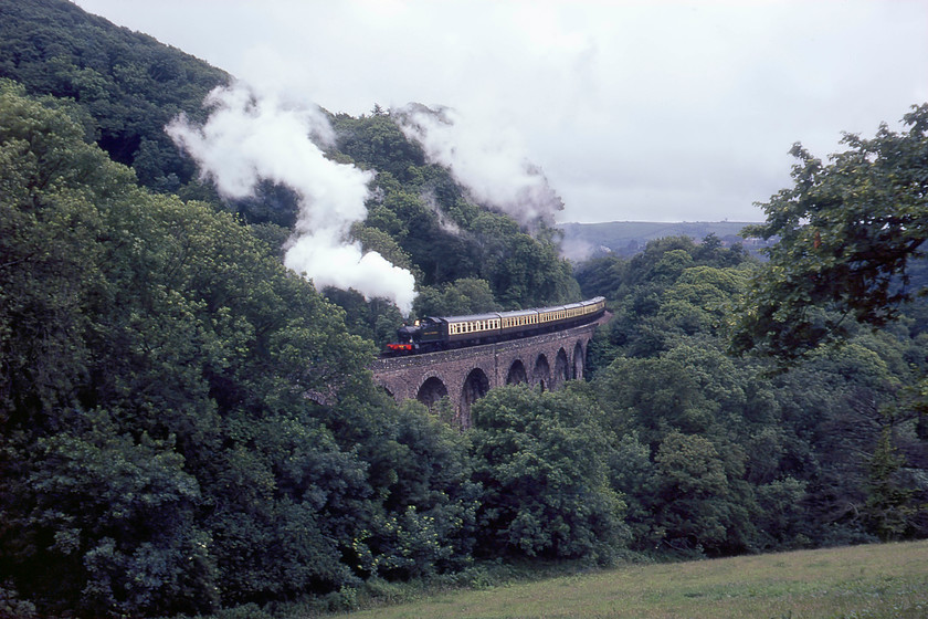 4588, 13.15 Kingswear-Paignton, Greenway viaduct 
 Long term resident of the South Devon Railway ex GWR Churchwood/Collett 2-6-2T 4588 climbs over Greenway viaduct leading the 13.15 Kingswear to Paignton service. 4588 was rescued from Barry in 1971 and sent to Swindon (its birthplace in 1927) for restoration, returning to steam in 1973. It worked on this line for many years with a short spell on the SVR before being sold and moved to Peak Rail where, at the time of writing (2020), it still languishes awaiting another full overhaul. 
 Keywords: 4588 13.15 Kingswear-Paignton Greenway viaduct