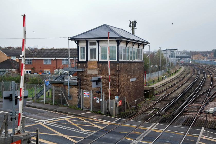 Gillingham Signal Box (Closed) (SEC, 1913) 
 Taken from the pedestrian footbridge the now closed Gillingham signal box is seen. The box closed in 2015 when a major signalling upgrade programme was activated. The box still stands at the level crossing on Church Street and looks to be in very good condition considering that it's been shut for three years. The box was constructed by the South Eastern and Chatham Railway in 1913. It was originally called Gillingham B but this suffix was dropped when the A box closed in 1973. 
 Keywords: Gillingham Kent signal box