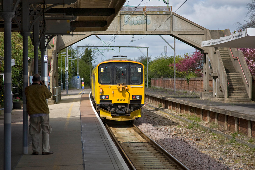 950001, 08.48 Ipswich-Clacton-on-Sea test train, Frinton-on-Sea station 
 Andy grabs a 'going away' shot of Network Rail's mobile recording train 950001 as it passes through Frinton-on-Sea as the 08.48 Ipswich to Clacton-on-Sea via most of Essex! It is commonly thought that 950001 is a converted Class 150 unit. However, it was actually purpose-built using the same design as the 150 because that was deemed to be cheaper than designing a whole new unit from scratch. Consequently, it emerged straight from the Class 150 production line at BREL's York facility in 1987. It is based at the RETC in Derby and is used primarily on branch lines where a lighter weight is required on what is often poorer quality track. 
 Keywords: 950001 08.48 Ipswich-Clacton-on-Sea test train Frinton-on-Sea station