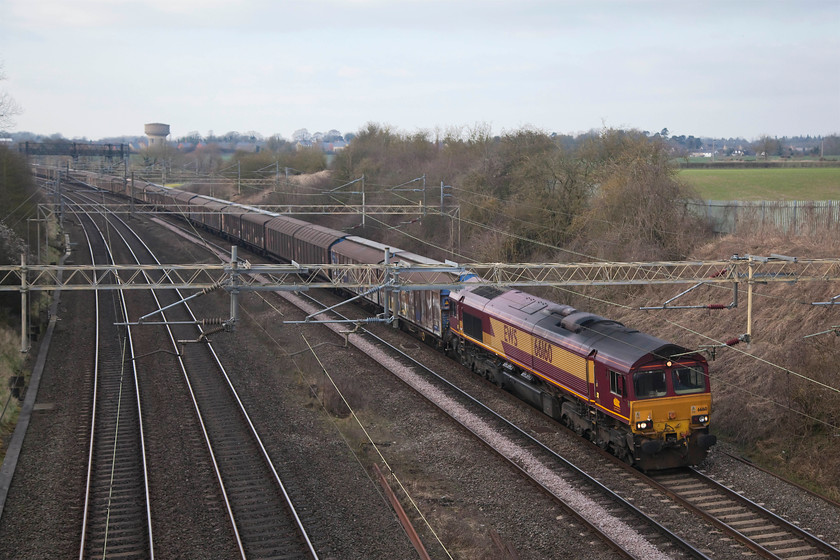 66160, 15.06 DIRFT-Dollands Moor (6O67), Victoria Bridge 
 66160 heads the regular 15.05 Daventry (DIRFT) to Dollands Moor empty cargo wagons working. This is a long train that runs pretty much daily and one that has a particular sound quite different to all others. As the southbound is running empty, I presume the sound from the bogies must resonate inside the empty steel wagons to make this noise. The balancing northbound working runs full of imported water bottles and has a very different sound as a result. I am acutely aware of these sounds (and all others on their section of line) as I live in the white house in this picture that can be seen just above the front of the class 66 in the middle distance. 
 Keywords: 66160 15.06 Daventry Dollands Moor 6O67 Victoria Bridge