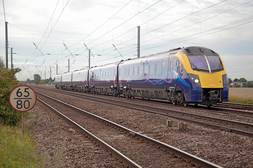 180109, HT 09.48 London Kings Cross-Hull (1H02, 12L), East Road level crossing TL192415 
 180109 heads north past East Road level crossing in the village of Langford. It is working the 09.48 London King's Cross to Hull Hull Trains service. This level crossing is at the end of a small road and is a private crossing for access to the farm and a house at the other side of the line. 
 Keywords: 180109 1H02 East Road level crossing TL192415